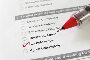 closeup of a business survey, with Strongly Agree checked