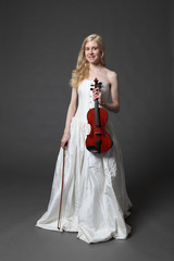 Beautiful young woman with a violin.