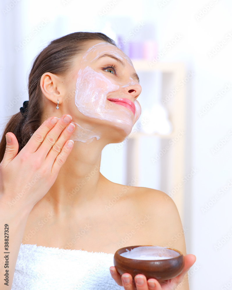 Wall mural beautiful woman applying natural homemade facial mask