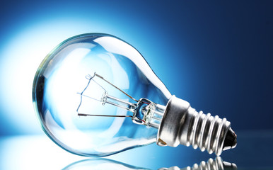 Light bulb on blue background