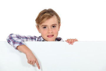 Little girl showing white sign for message
