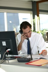 Smiling businessman talking on the phone