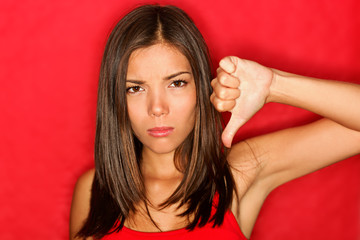 Naklejka premium Unhappy thumbs down woman