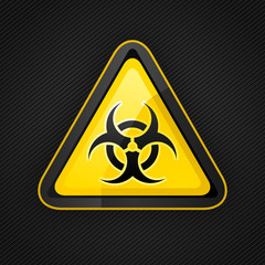 Hazard warning triangle biohazard sign on a metal surface