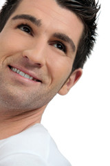Fototapeta premium close shot of man looking upwards