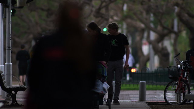 Stock Video Footage of Tel Aviv residents walking with strollers shot in Israel at 4k with Red.