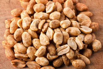 Pile of peanuts on a wooden board