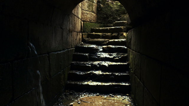 Stock Video Footage of an ancient tunnel filling with water shot in Israel at 4k with Red.