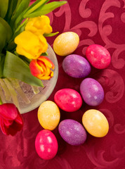 Fototapeta na wymiar Colorful easter eggs and vase with tulips