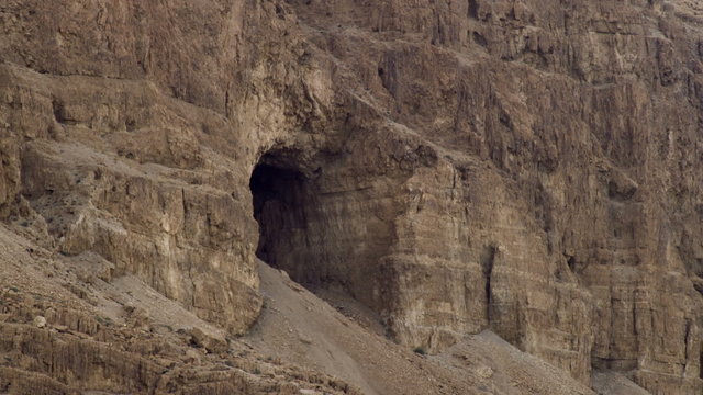 Stock Video Footage of a cave in a cliff face shot in Israel at 4k with Red.