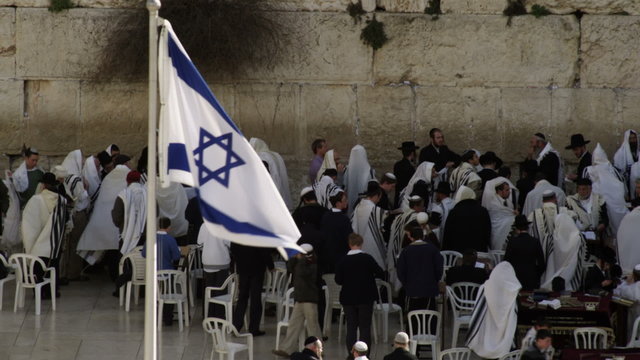 Stock Video Footage of male Jews at the Western Wall filmed in Israel at 4k with Red.