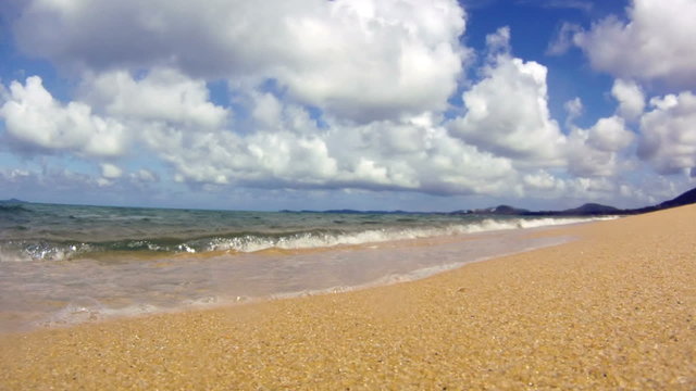 Ocean waves on tropical sand beach