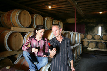 Winemakers drinking wine in a winery