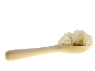 cooked rice on a wooden spoon