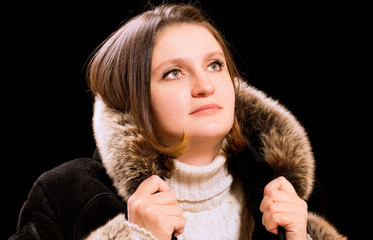 Beautiful woman in winter fur coat