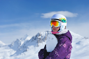Woman holding snowboard