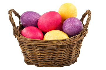 Easter basket with eggs isolated on white