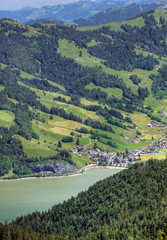 Fototapeta na wymiar Switzerland: town at mountain lake