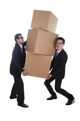 Businessmen carrying boxes