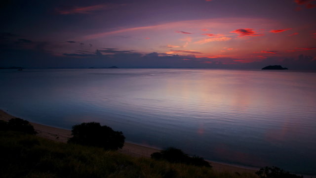 Time-lapse - Sunset over a tranquil sea, Indonesia