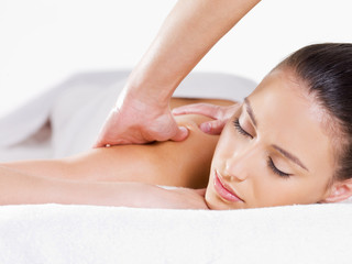 Woman having massage in spa salon