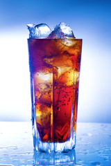 A fresh glass of cola with ice