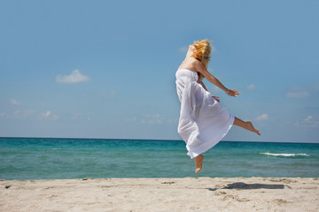 young woman flying on sea background