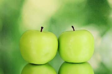 Apple candle on green background
