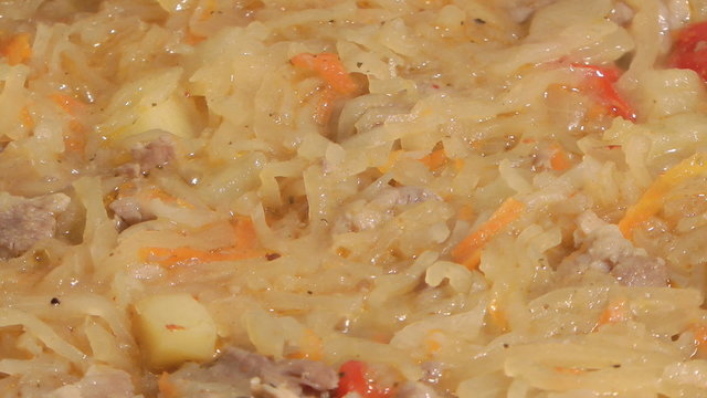 Dish of stewed meat and cabbage with spices.