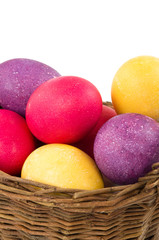 Easter eggs in basket isolated on white