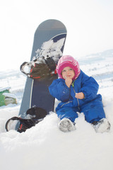 Fototapeta na wymiar Baby and snow board