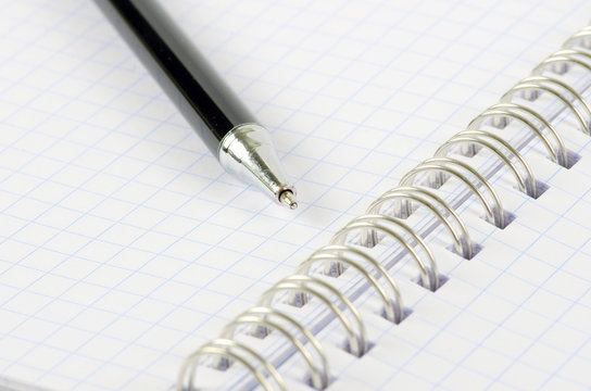notebook with a pen