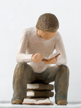 Figur eines lesenden Mannes