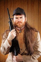 Southern Hick with a rifle and flowing hair - obrazy, fototapety, plakaty