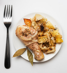 Grilled chicken wings served with potato