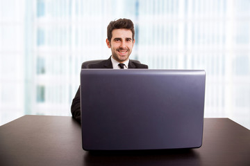 young business man working with is laptop at the office