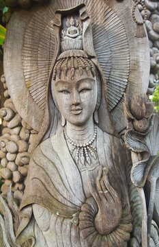 Kuan Yin image of buddha , Wood carving in Thailand