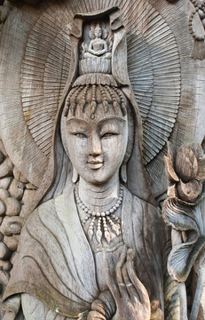 Kuan Yin image of buddha , Wood carving in Thailand