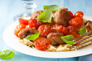 Farfalle pasta with meatballs and cherry tomatoes
