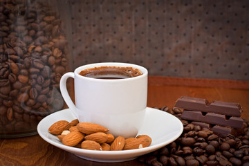 cup of coffee, almonds and chocolate