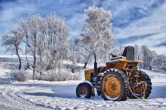Winter sceneries in Lithuania, old tractor under the snow