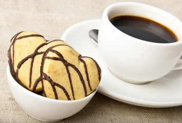 cup of coffee and cookies with chocolate