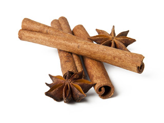 Aniseed and cinnamon on white background