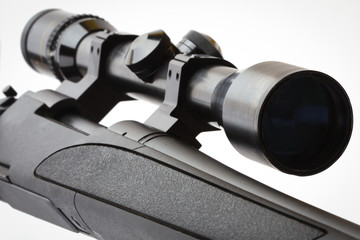 black hunting rifle with optics isolated on white