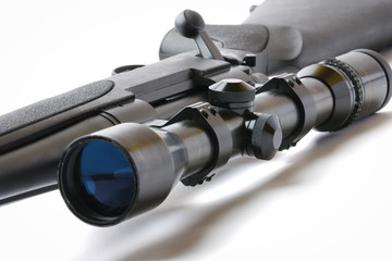 black hunting rifle with optics isolated on white