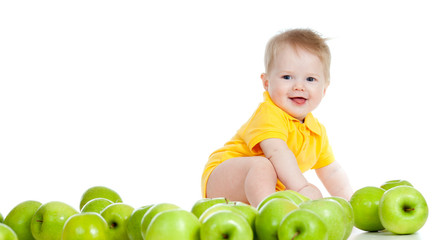 Fototapeta na wymiar Adorable child with green apples isolated on white background