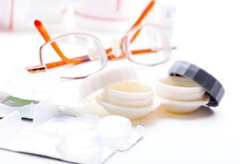 Close-up of contact lenses in container with solution. .