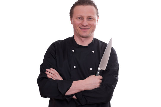 Koch mit lächeln und einem Messer