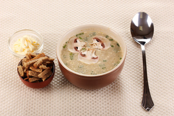 Tasty soup on beige tablecloth