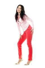 Smiling brunette in red jeans